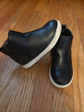 Black zip up boots. Glitter on the back and sides perfect for any outfit!